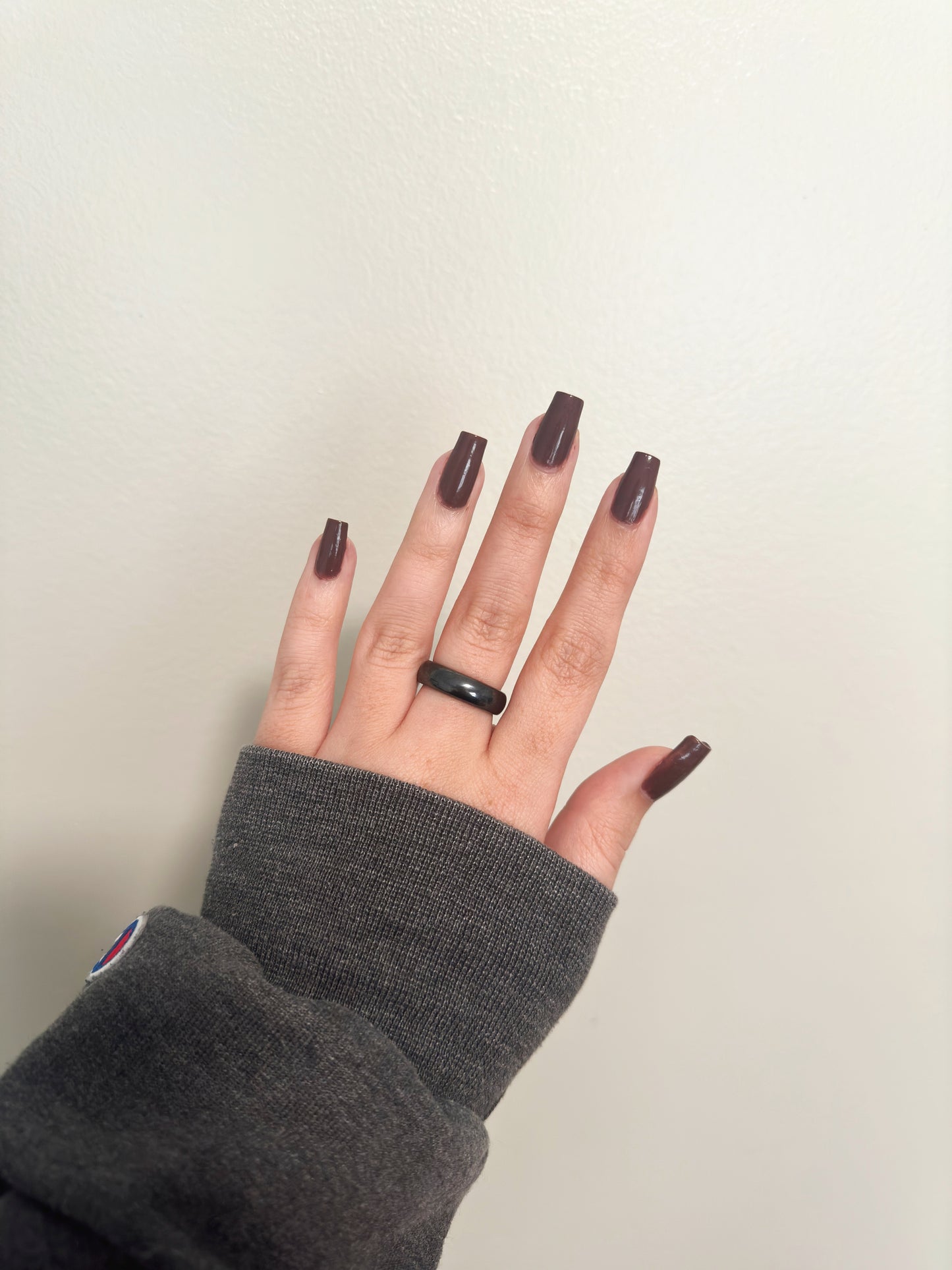 Neutral brown nail polish.