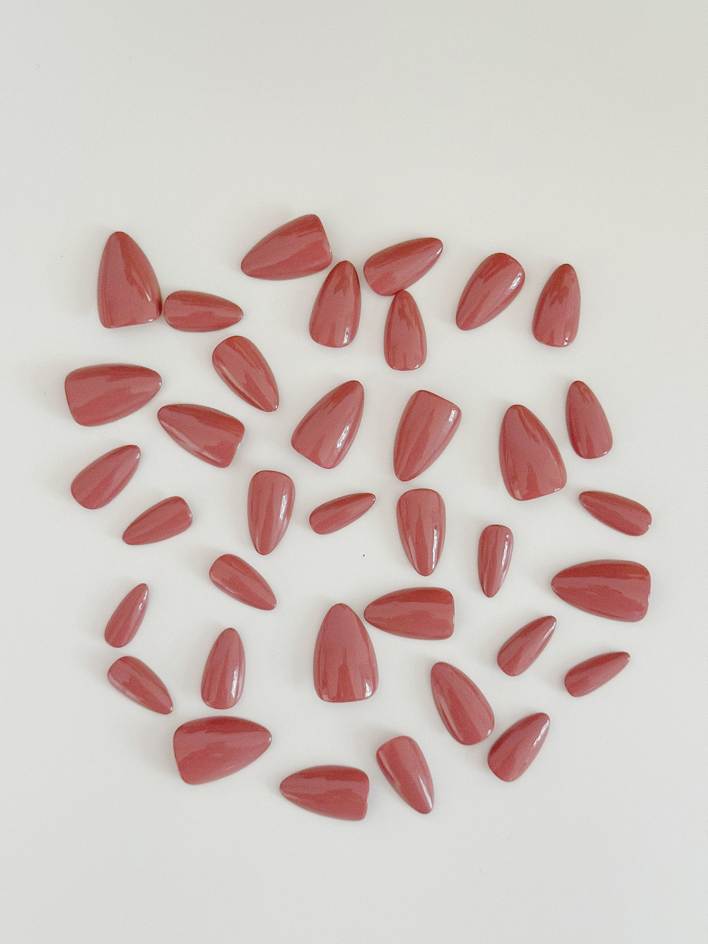 Mauve, short to medium length, almond shaped press on nails.