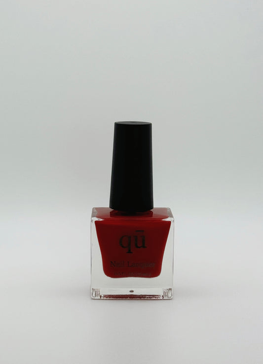 Classic crimson red nail polish.