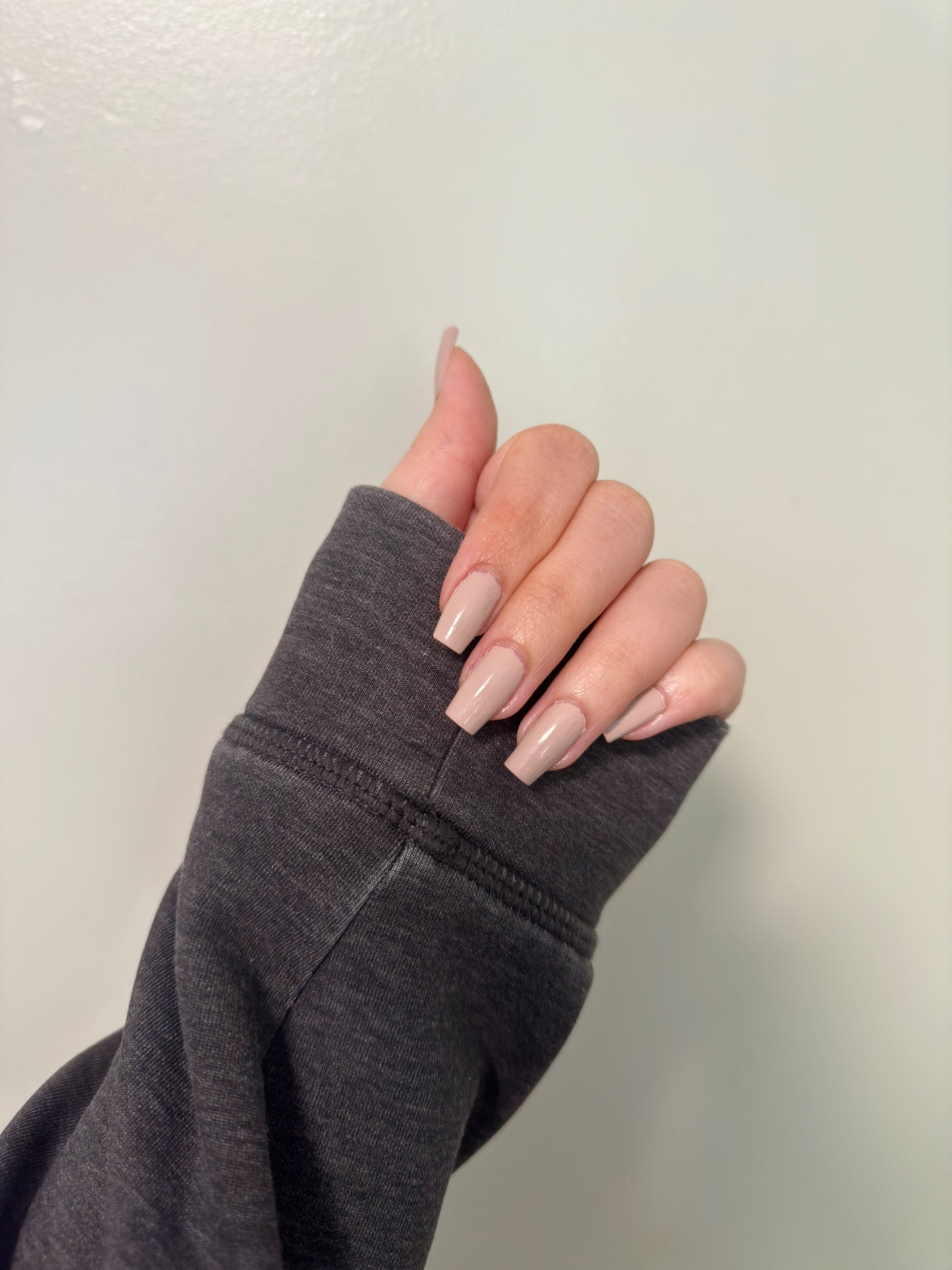 Light neutral nail polish.