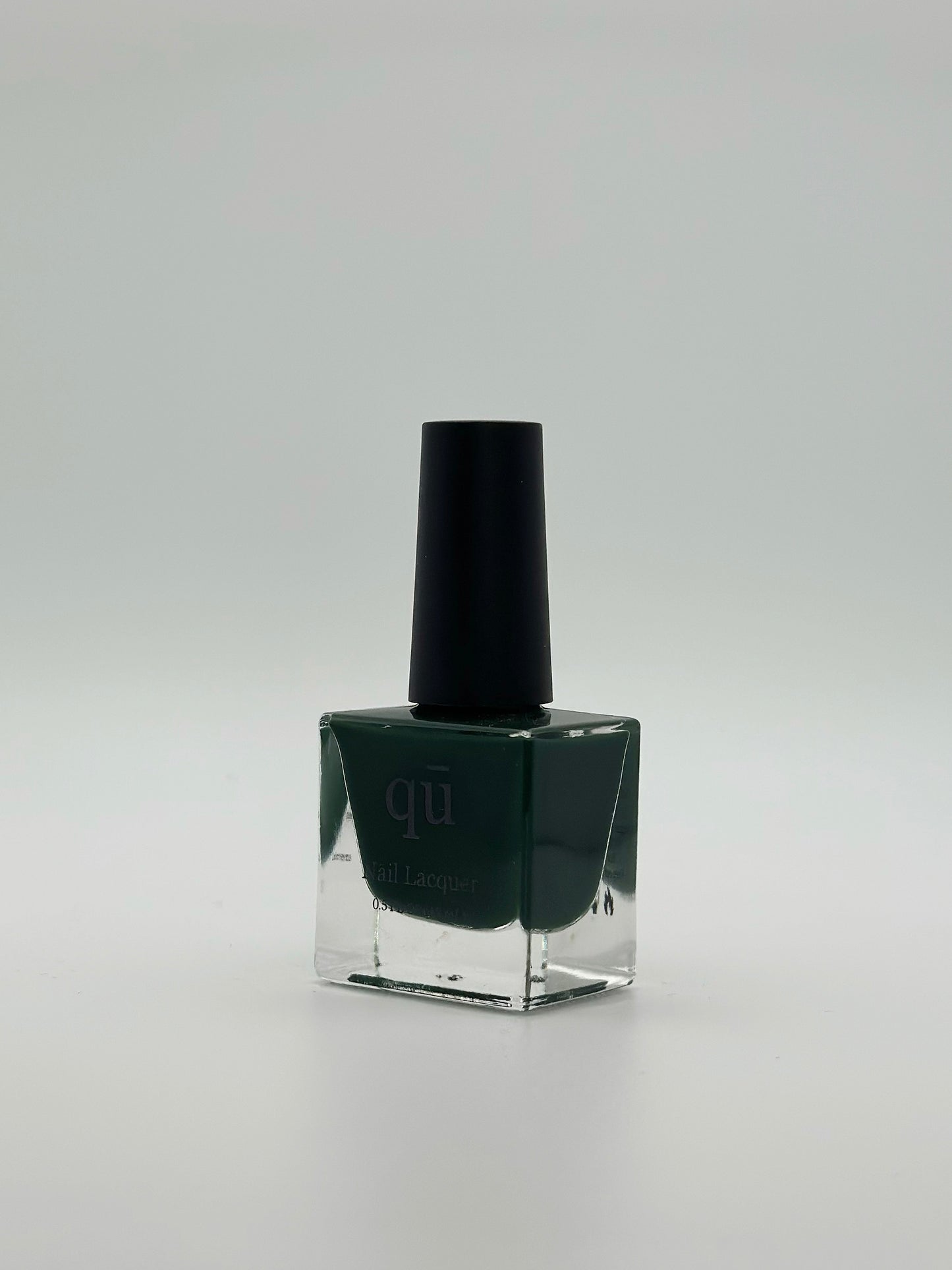 Dark forest green nail polish.